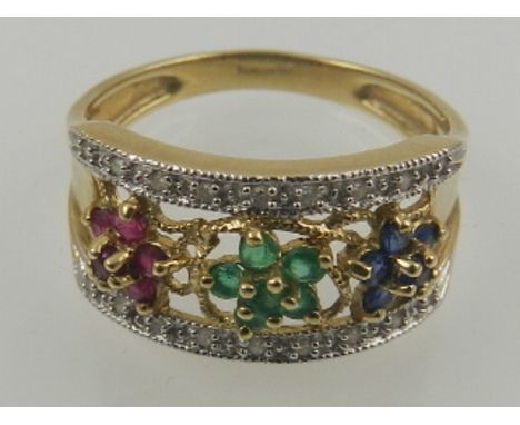 A 9 carat yellow gold, sapphire, emerald, ruby and diamond floral cluster ring. 