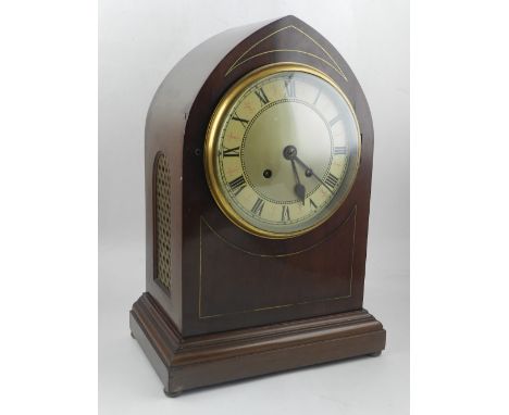 An early 20th century mahogany lancet shaped bracket clock, the enamel dial with Roman numerals and outer minute track, eight