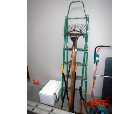 A quantity of garden tools & a ladder