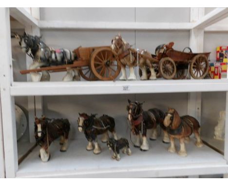 2 shelves of ceramic shire horses