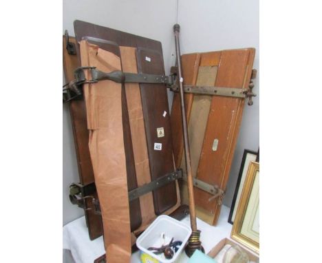 A vintage trouser press and a vintage curtain/door rail