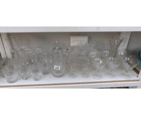 A shelf of glass ware