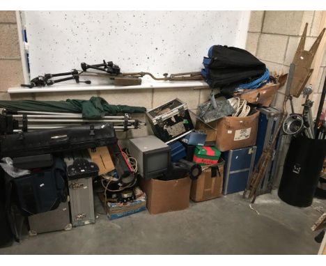 A large quantity of camera tripods etc