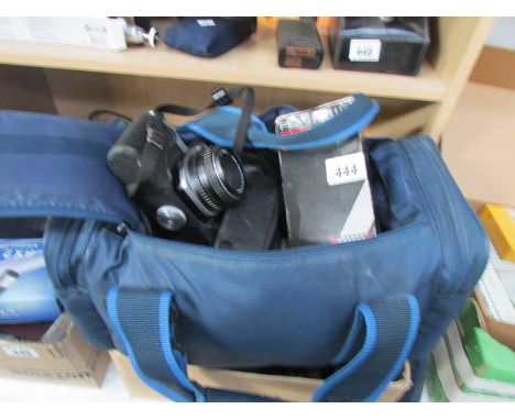 A Pentax camera, lenses and accessories