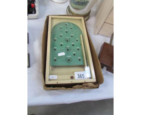 A small vintage bagatelle game