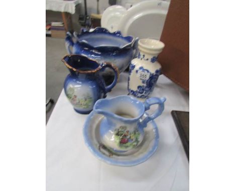 A Staffordshire jardiniere, jug, vase, and jug & basin set