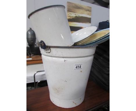 An enamel bucket and other enamel ware
