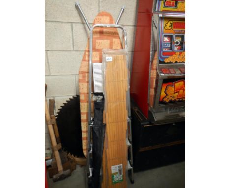 A quantity of miscellaneous items including ironing board & step ladders etc.