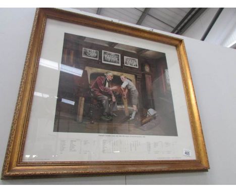 A framed and glazed calendar print