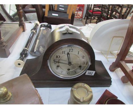 An oak mantel clock
