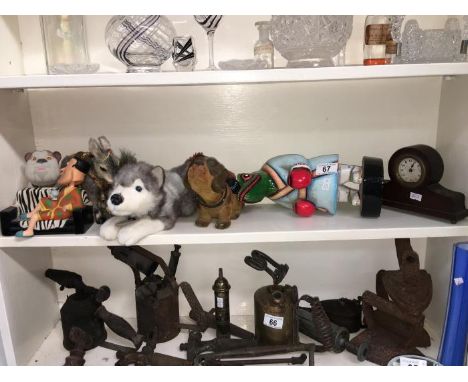 A shelf of interesting items including mantel clock