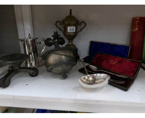 A mixed lot of silver plate including ladle, Butlins' trophy and art deco rise and fall ceiling light weight