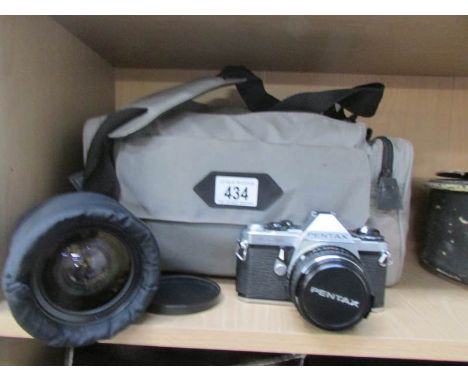 A Pentax SLR 35 mm camera with lenses etc
