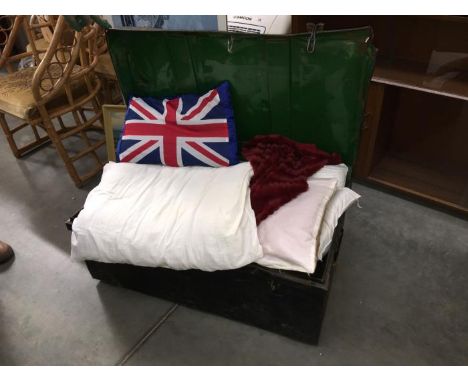 An old metal trunk and contents