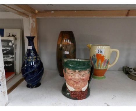 A Royal Doulton Mr Pickwick character jug, a Royal Doulton vase a/f, A Clarice Cliff jug a/f and one other vase