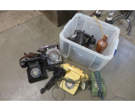 A box of vintage telephones and three decorative cast iron keys