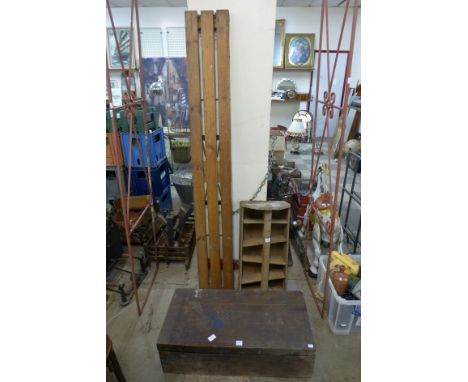 A tool box with tools, bottle crate and a folding bench