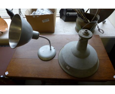 An industrial light shade and an industrial anglepoise lamp