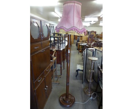 A Chinese carved hardwood standard lamp