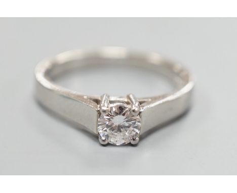 A modern platinum and solitaire diamond ring, size M, gross weight 5.2 grams, the stone diameter 4.8mm.