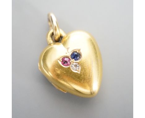 An Edwardian 15ct, sapphire, diamond and ruby set heart shaped locket, 17mm, gross weight 5.7 grams.