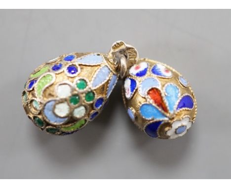 An early 20th century Russian 84 zolotnik and polychrome cloisonné enamel set egg pendant, maker's mark HT?, 17mm and a simil