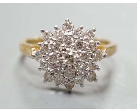 A modern 18ct gold and diamond cluster set flower head ring, size R/S, gross weight 5.5. grams.