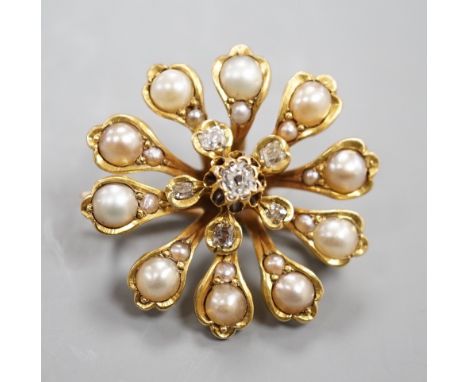 A Victorian yellow metal (tests as 15ct), diamond and split pearl set pendant brooch, 26mm, gross weight 6.9 grams.