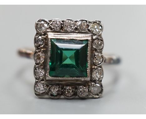 An 18ct gold, green paste? and diamond set square cluster ring, size L, gross weight 2.2 grams.