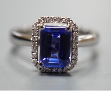 A modern 18k white metal, tanzanite and diamond set rectangular cluster dress ring, size M, gross weight 5 grams, the tanzani