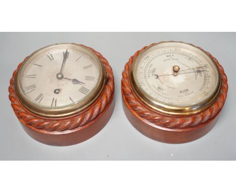 A Victorian teak cased bulkhead timepiece by Benzie, Cowes, Isle of Wight with matching aneroid barometer, both with carved r