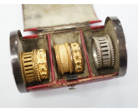 A rare Regency morocco leather mounted white metal cylindrical ring box containing five pinchbeck/base metal sample rings, bo
