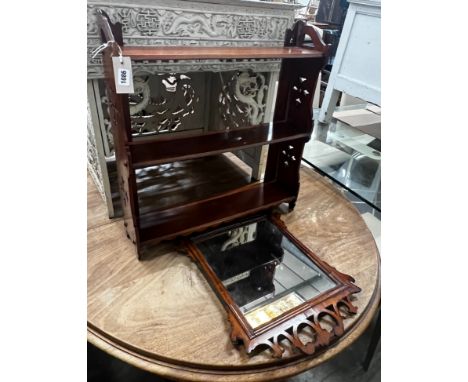 A Victorian mahogany three tier wall bracket, width 61cm height 63cm, and a small walnut fret cut wall mirror, height 52cm