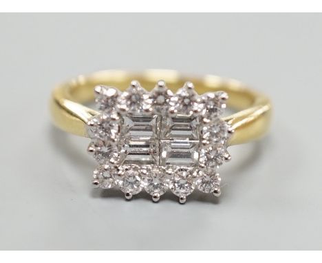 A 750 yellow metal, baguette and round cut diamond set rectangular cluster ring, size M, gross weight 4.8 grams.