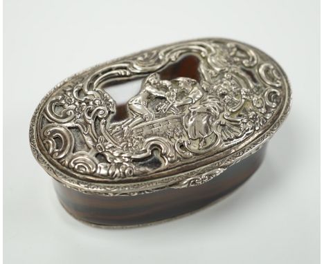 A 19th century continental white metal mounted banded agate oval snuff box, decorated with figures amid scrolls, length 79mm.