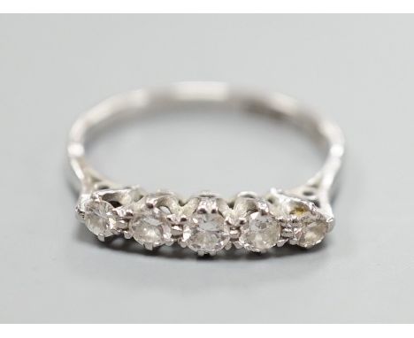A plat and 18ct five stone diamond set half hoop ring, size K, gross weight 2 grams.