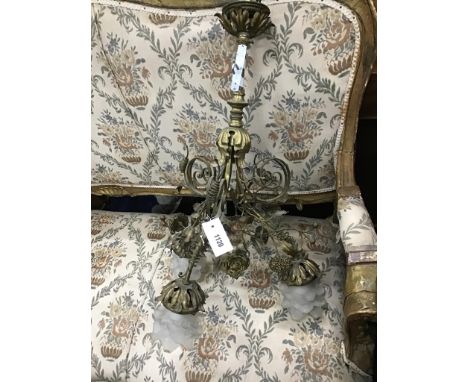 An early 20th century French brass three branch ceiling light with opaque glass shades, height  68cm