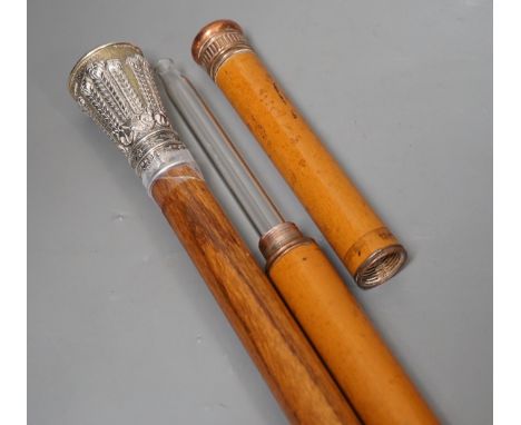 A silver handled cane win a horn tip and a copper handled flask cane,silver handled cane 94 cms long,