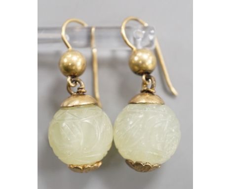 A pair of antique gilt metal and carved hardstone spherical drop earrings, jade diameter 14mm.