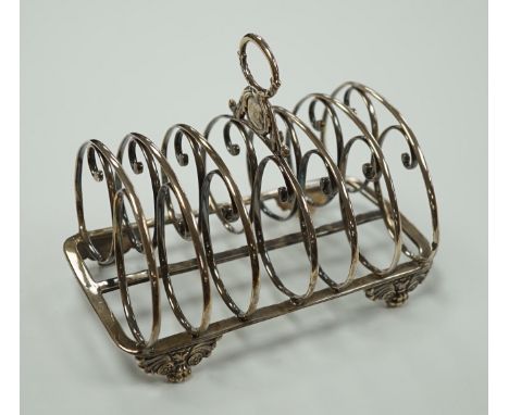 A William IV silver seven bar toastrack, with ring handle, on winged paw feet, Settle &amp; Wilkinson, Sheffield, 1830, lengt