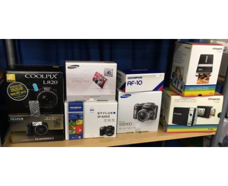 6 assorted digital cameras plus a Polaroid camera and printer. (8) [NO RESERVE]