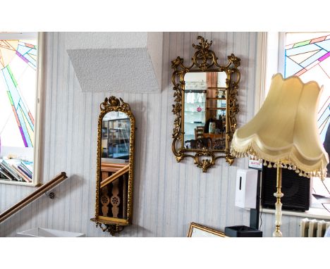 Two Gilt Framed Mirrors, comprising a wall mirror with ornate gilt frame, measures 42" x 22", and a wall mirror with a small 