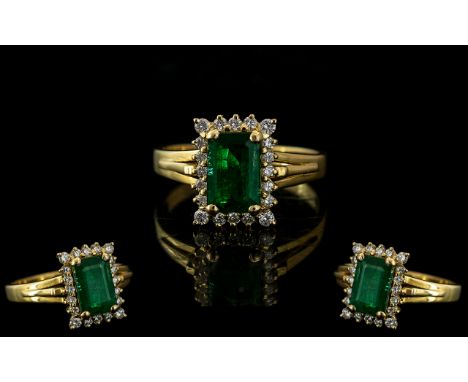 Ladies 18ct Gold - Attractive Emerald and Diamond Set Dress Ring. Marked 750 - 18ct to Interior of Shank. The Central Step Cu