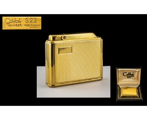 Colibri 523 Superb Gold Plated Monogas Lighter with Colibri Display Box. Engine Turned Panels In As New Condition. 2 Inches -