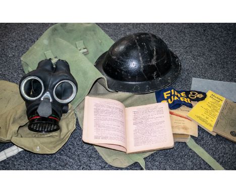 Military Interest - Green Canvas Bag containing a tin hat, gas mask in canvas bag, Fire Guard arm band, Warden and CD badges,