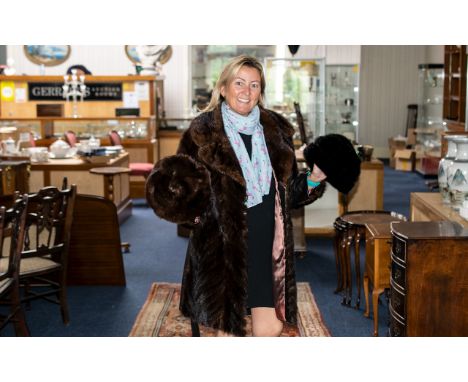 Ladies Quality Mink Coat with leather side panels, sleeve panels, and tie belt.  Double breasted, button fastening, shawl col