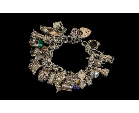 Excellent Vintage Sterling Silver Charms Bracelet - Loaded with 27 Good Quality Silver Charms. All Marked for Silver. Compris