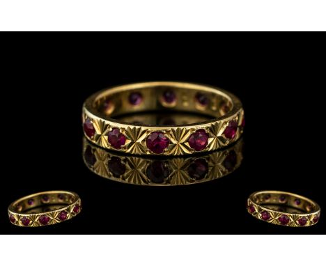 18ct Yellow Gold - Attractive Ruby Set Full Eternity Ring. Marked 18ct to Interior of Shank. Rubies of Good Colour. Ring Size