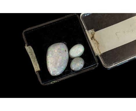 A Large Australian Milky Opal with Orange / Green Colours. Est Weight 6.00 cts + A Further Two Oval Shaped Opals, With Orange