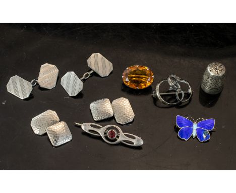 Small Collection of Silver Items, comprising a silver engraved thimble, a silver stone set bar brooch, a scroll shaped brooch